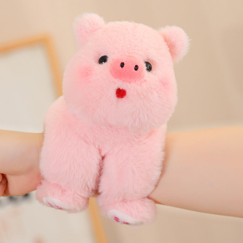 pig plush toyplush toy on a hand