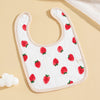 strawberry baby bib on a kaki background