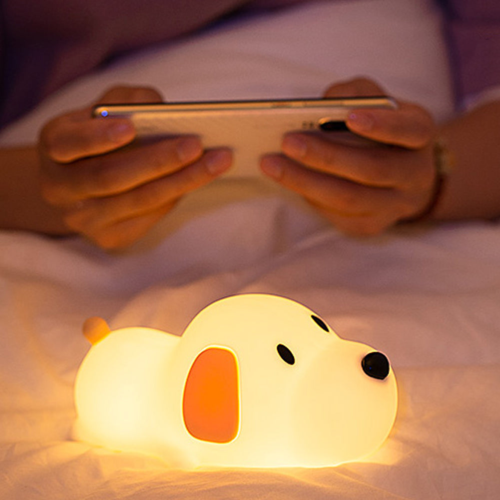 Papa Puppy: Bedtime Night Light on a bed with mobile phone
