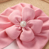 Load image into Gallery viewer, Baby Borderless Flower Hat pink closer look on a flower