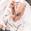 a cute girl wears Bowknot Baby Headband